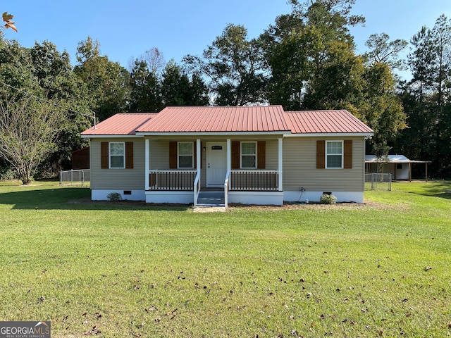 ranch-style house with covered porch and a front yard