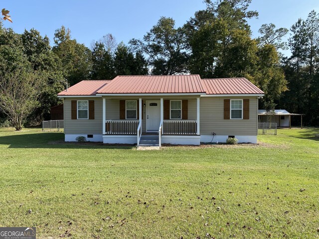 108 Sunset Dr, Dublin, GA 31027 - manufactured / mobile home with covered porch, a front yard, metal roof, and crawl space