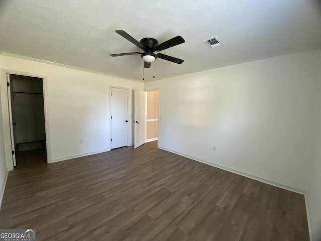 108 Sunset Dr, Dublin, GA 31027 - unfurnished bedroom featuring visible vents, baseboards, ceiling fan, and dark wood-type flooring
