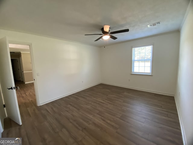 108 Sunset Dr, Dublin, GA 31027 - unfurnished room featuring dark wood-type flooring, visible vents, ceiling fan, and ornamental molding