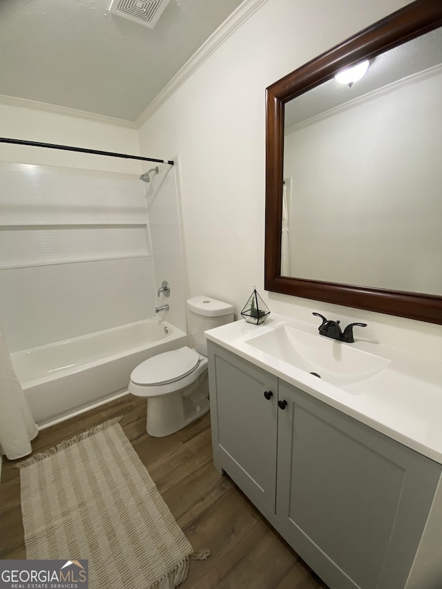 108 Sunset Dr, Dublin, GA 31027 - full bath featuring toilet, ornamental molding, shower / bathing tub combination, wood finished floors, and vanity