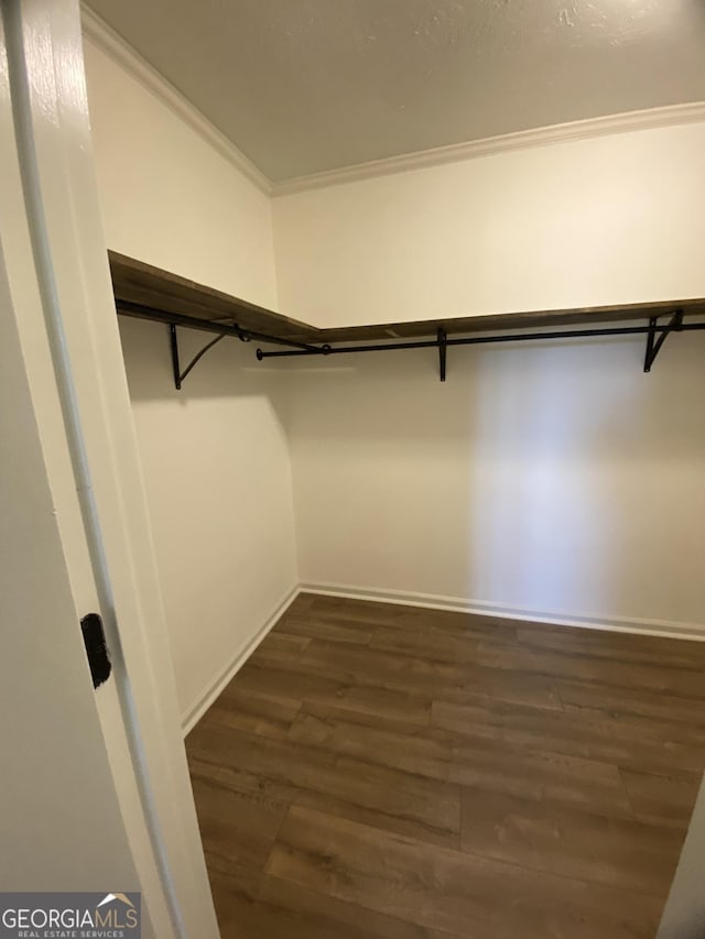 108 Sunset Dr, Dublin, GA 31027 - spacious closet featuring dark wood-style floors