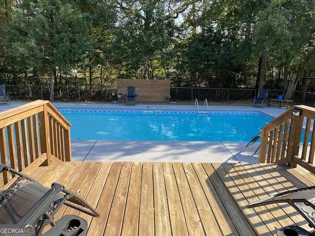 108 Sunset Dr, Dublin, GA 31027 - view of swimming pool featuring fence, a deck, and a fenced in pool