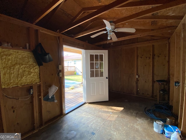 doorway to outside with ceiling fan and lofted ceiling