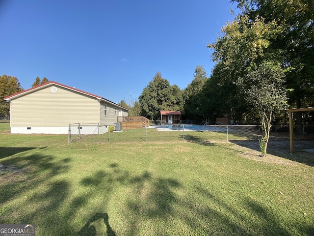 108 Sunset Dr, Dublin, GA 31027 - view of yard featuring central AC, a fenced backyard, and a deck