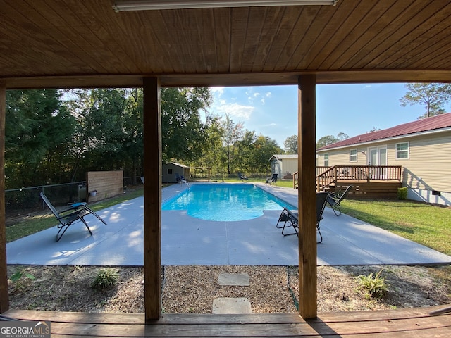 view of pool featuring a deck and a patio area