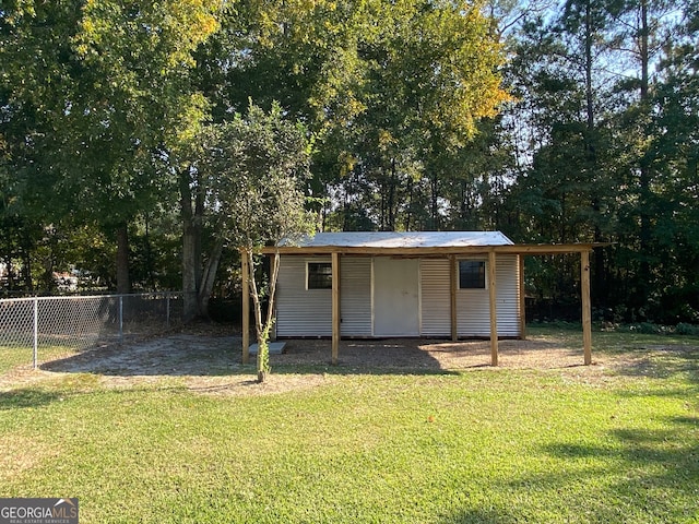 view of outdoor structure with a yard