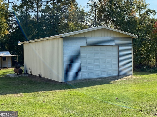 garage featuring a lawn