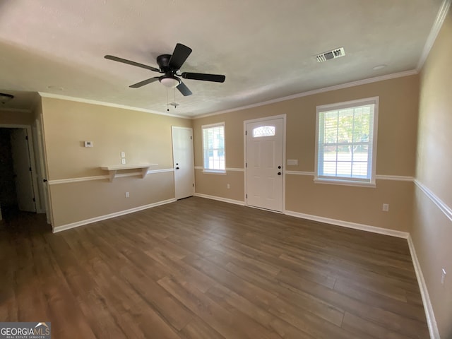 interior space with ceiling fan, ornamental molding, and dark hardwood / wood-style floors