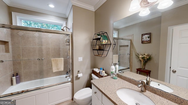 full bathroom with shower / bath combination with glass door, crown molding, vanity, and toilet