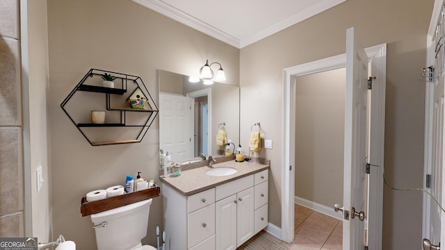 bathroom featuring baseboards, toilet, tile patterned flooring, crown molding, and vanity