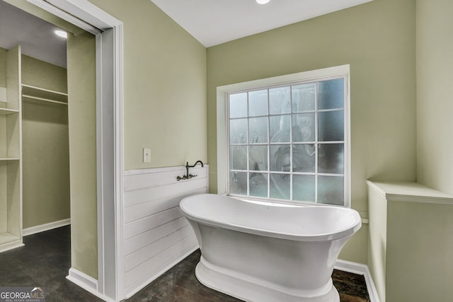 bathroom featuring a tub to relax in