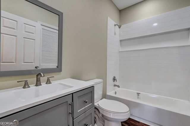 full bathroom with vanity, tub / shower combination, wood-type flooring, and toilet