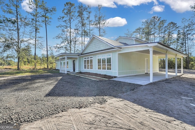 view of side of home featuring a carport