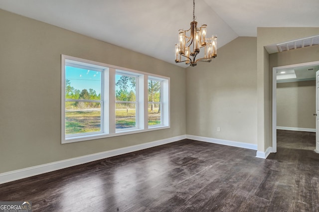 empty room with vaulted ceiling, a notable chandelier, and dark hardwood / wood-style flooring