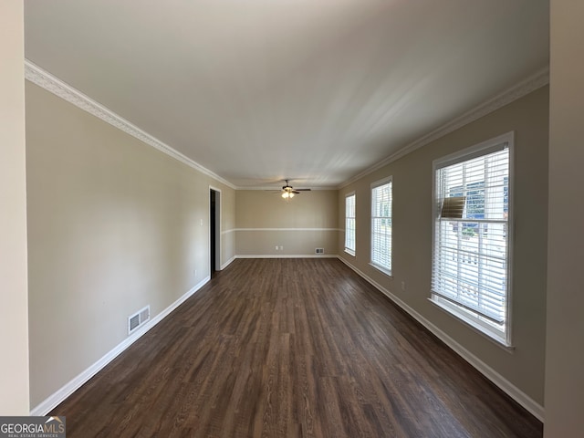 unfurnished room with dark wood-type flooring, crown molding, and ceiling fan