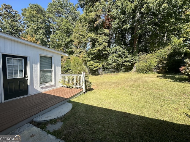 view of yard with a deck