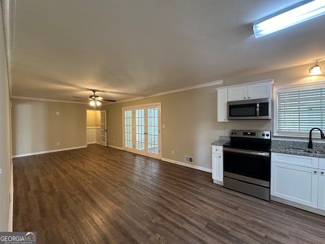 kitchen featuring french doors, white cabinetry, stainless steel appliances, and dark hardwood / wood-style floors