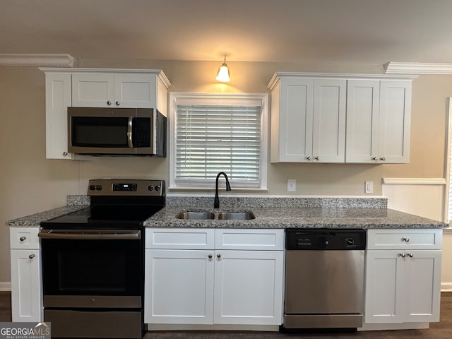 kitchen featuring white cabinetry and appliances with stainless steel finishes