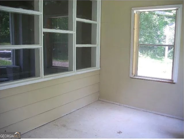 exterior space with concrete floors and a wealth of natural light