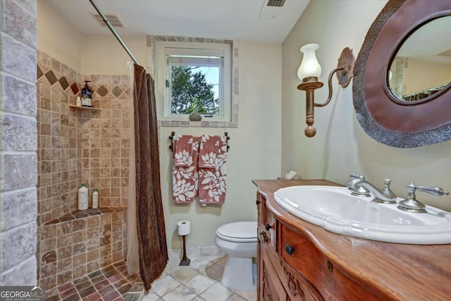 bathroom featuring vanity, a shower with curtain, toilet, and tile patterned flooring