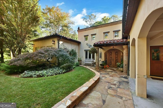 exterior space with a patio area and a yard