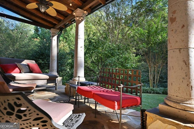 view of patio featuring ceiling fan