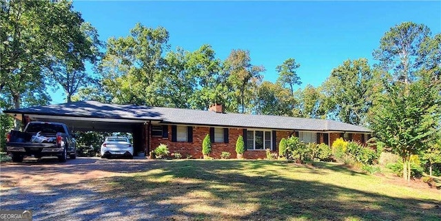 ranch-style home with a front lawn and a carport