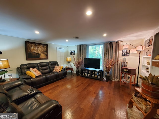 living room with wood finished floors, visible vents, and recessed lighting