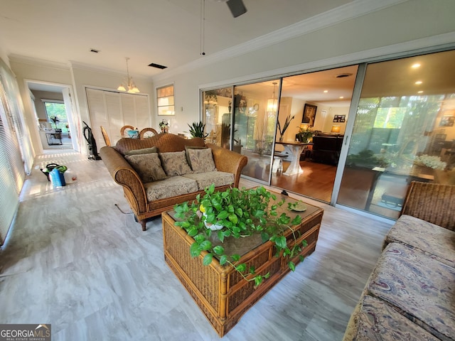 living room featuring ornamental molding and wood finished floors