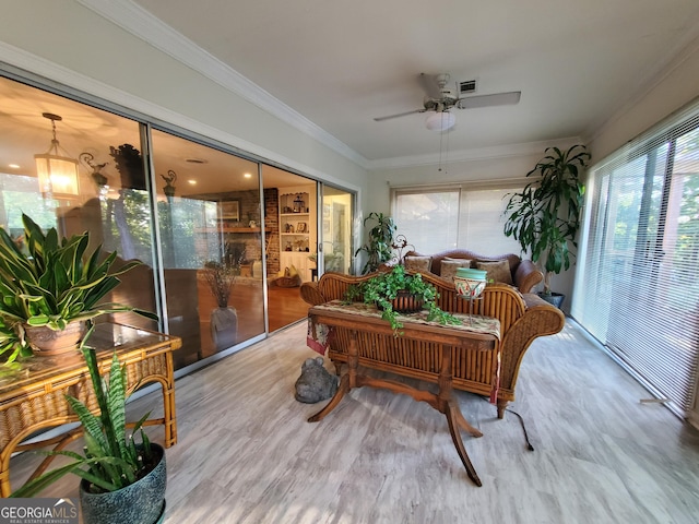 sunroom with visible vents and ceiling fan