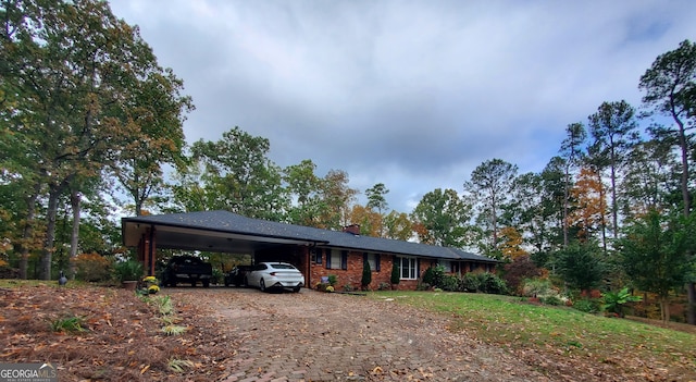 ranch-style house with a carport