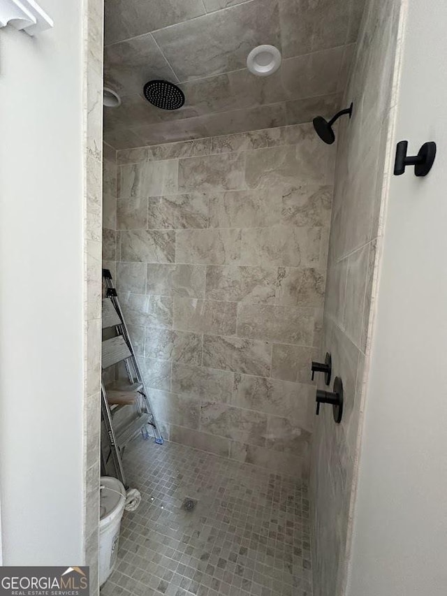 full bath featuring a shower stall and toilet