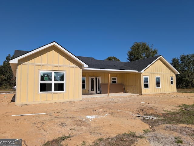 back of house featuring board and batten siding