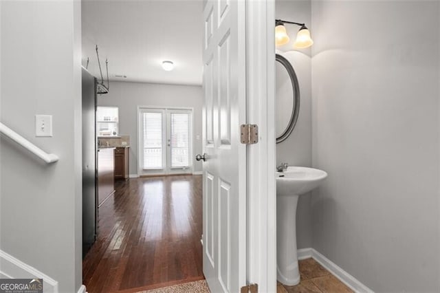 bathroom with wood-type flooring