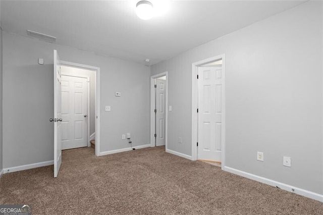 unfurnished bedroom with carpet flooring