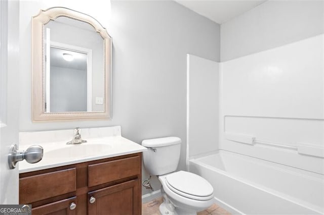 full bathroom with vanity, washtub / shower combination, toilet, and tile patterned floors