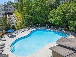 view of swimming pool with a patio area