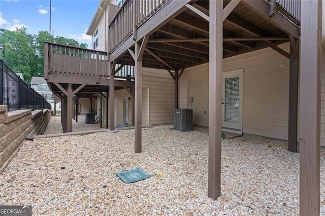 view of patio featuring a deck and central air condition unit