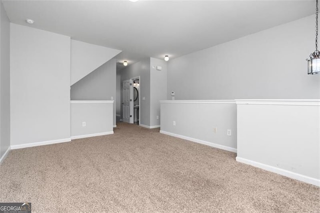 interior space featuring a notable chandelier and carpet flooring