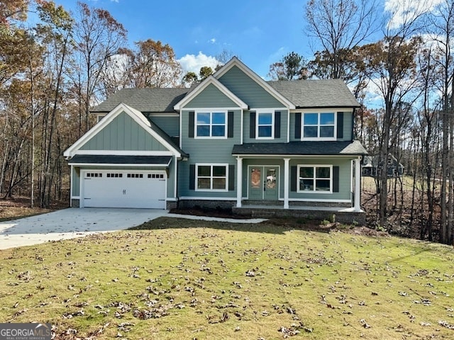 view of front of house featuring a front yard and a garage