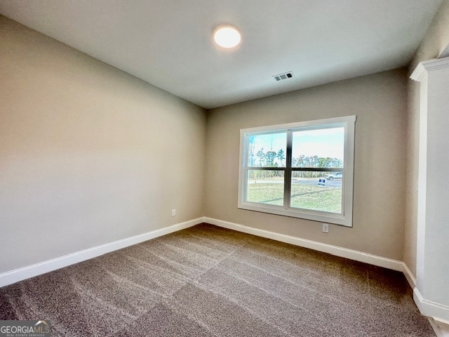 spare room featuring carpet flooring