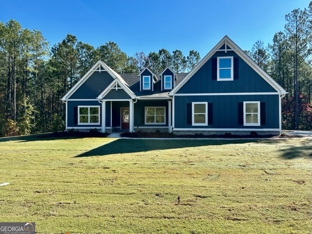 view of front of property with a porch and a front lawn