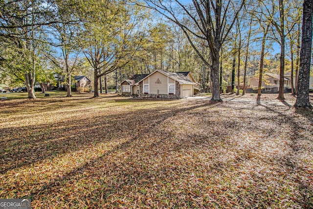 view of yard featuring a garage