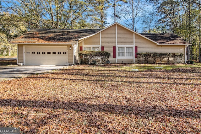 single story home with a garage