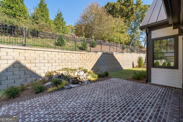 view of patio featuring fence