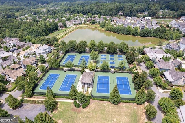 drone / aerial view featuring a water view and a residential view