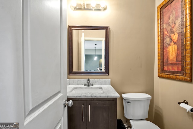 bathroom with vanity and toilet