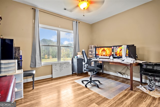 office area with light hardwood / wood-style flooring and ceiling fan