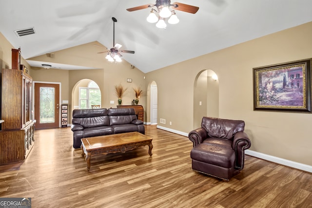 living room featuring hardwood / wood-style floors, ceiling fan, and high vaulted ceiling